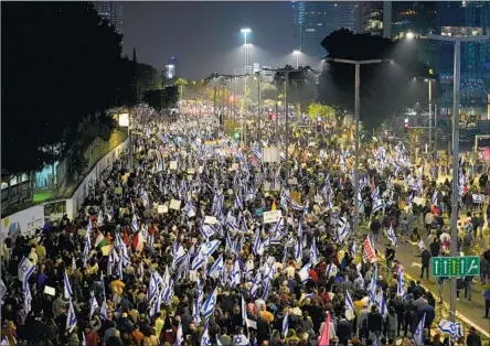  ?? Tsafrir Abayov Associated Press ?? ISRAELIS protest in Tel Aviv against plans for a judicial overhaul that would allow a legislativ­e majority to override the Supreme Court.