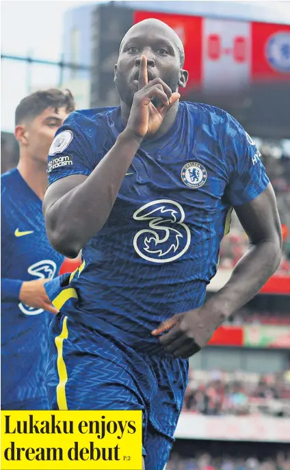  ??  ?? Silencer: Striker Romelu Lukaku goads the Arsenal supporters after announcing his return to Chelsea with a goal inside 15 minutes