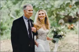  ?? ERIKA MAHONEY ON TEITTER ?? Erika Mahoney being walked down the aisle by her Father, Kevin Mahoney, who was killed Monday in a mass shooting in Colorado,