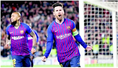  ?? AP ?? Barcelona’s Lionel Messi (right) celebrates after scoring his side’s third goal during the Champions League roundof-16 second leg match between FC Barcelona and Olympique Lyon at the Camp Nou stadium in Barcelona, Spain, recently.