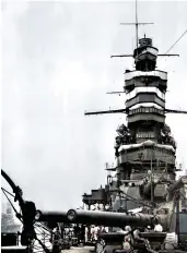  ?? ?? A 1940 view of the forward 14in gun turrets and pagoda superstruc­ture of IJN Kongõ. Note the enclosed main and compass bridges and the white tarpaulins to protect against splinter damage