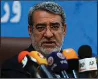  ?? AP/VAHID SALEMI ?? At a news conference Sunday in Tehran, Iranian Interior Minister Abdolreza Rahmani Fazli blames “people that are recognized by us as foes” for protests that began late Saturday. Fazli said no deaths occurred in the clashes between the protesters and...