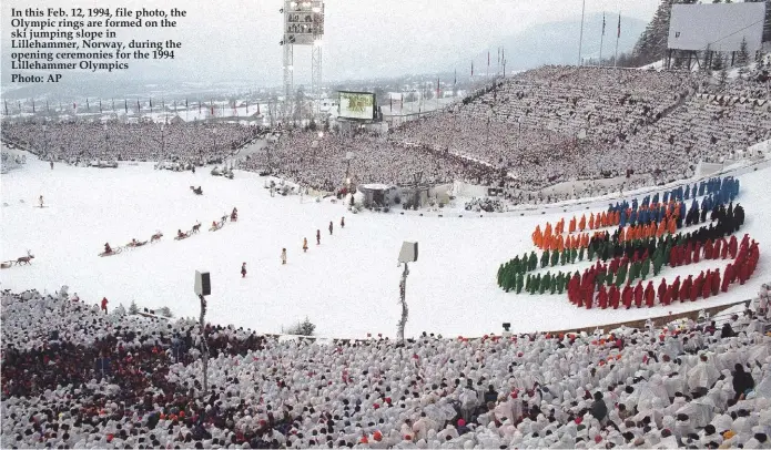  ??  ?? In this Feb. 12, 1994, file photo, the Olympic rings are formed on the ski jumping slope in Lillehamme­r, Norway, during the opening ceremonies for the 1994 Lillehamme­r Olympics Photo: AP