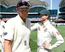  ?? PHOTO: GETTY IMAGES ?? England captain Joe Root congratula­tes Steve Smith after Australia’s win in Adelaide.