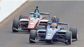  ?? / USA TODAY SPORTS ?? Aaron Telitz (rear) finishes second to Matheus Leist last month in the Freedom 100 Indy Lights race. Telitz is just 29 points behind the leader in the standings heading into this weekend.