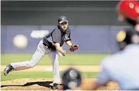  ?? Associated Press ?? Highly touted offseason acquisitio­n Masahiro Tanaka enjoyed a successful spring training debut Saturday, tossing two scoreless innings for the Yankees.