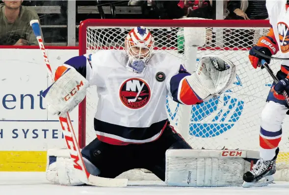  ?? BRUCE BENNETT/ GETTY IMAGES/ FILE ?? Goaltender Anders Nilsson, shown in action with the New York Islanders in 2014, wants to challenge for the No. 1 netminding job in Edmonton.