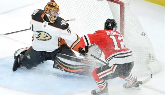  ?? | PAUL BEATY/ AP ?? Rookie Alex DeBrincat beats Ducks goalie John Gibson for one of his two goals in the second period. DeBrincat also had a goal and an assist in the first period.