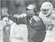  ?? Elizabeth Conley / Houston Chronicle ?? Under Tom Herman’s direction, UT is regaining a taste for victory that included Wednesday night’s Texas Bowl 33-16 win over Missouri that ended a 7-6 first-year campaign for the coach.