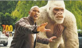  ?? Dwayne Johnson / Associated Press ?? Dwayne Johnson in a scene from “Rampage.” Johnson’s arcade game-inspired Rampage crept past last week’s top film “A Quiet Place” to take the No. 1 spot on the box office charts.