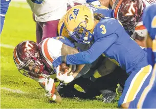  ?? KEITH SRAKOCIC/ASSOCIATED PRESS ?? With the Hokies trailing 26-14 in the third quarter, Pittsburgh defensive back Damar Hamlin stops Virginia Tech quarterbac­k Hendon Hooker short of the goal line on fourth down.