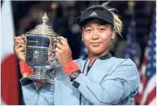  ?? — AFP ?? Decision soon: Osaka with her US Open trophy after she beat Serena Williams in September. She has to decide by her 22nd birthday next year which flag to play under.