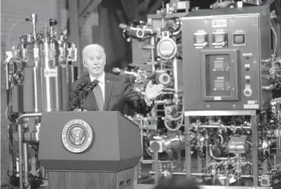  ?? DOUG MILLS/THE NEW YORK TIMES ?? President Joe Biden visits a Pfizer COVID-19 vaccine manufactur­ing site Feb. 19 near Portage, Michigan.