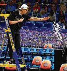  ?? MORRY GASH/ASSOCIATED PRESS ?? Stanford head coach Tara Vanderveer cuts down the net after the championsh­ip game win Sunday night over Arizona. “I really feel like we won this for all the great players that have played at Stanford,” Vanderveer said.