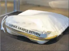 ?? RICHARD DREW — ASSOCIATED PRESS ARCHIVES ?? The Apollo 11 Contingenc­y Lunar Sample Return Bag used by astronaut Neil Armstrong is displayed at Sotheby’s in New York. The bag, used during the first manned mission to the moon, sold for $1.8 million Thursday.