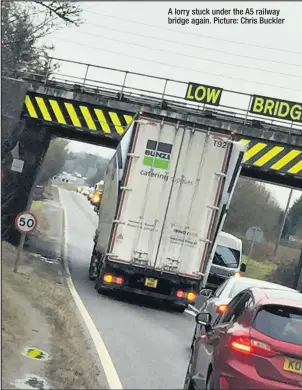  ??  ?? A lorry stuck under the A5 railway bridge again. Picture: Chris Buckler