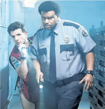  ?? SUPPLIED PHOTO ?? Adam Scott, left, and Craig Robinson star in the new sitcom Ghosted, about a mall cop who’s hired by a government agency to investigat­e the paranormal in Los Angeles.