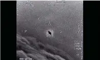  ?? Department of Defense via AP ?? ■ In this image from video provided by the Department of Defense labelled Gimbal, from 2015, an unexplaine­d object is seen at center as it is tracked as it soars high along the clouds, traveling against the wind. “There’s a whole fleet of them,” one naval aviator tells another, though only one indistinct object is shown. “It’s rotating.” The U.S. government has been taking a hard look at unidentifi­ed flying objects, under orders from Congress.