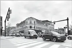  ?? JEREMY LITTLE/UNIVERSITY OF MICHIGAN COLLEGE OF ENGINEERIN­G VIA AP ?? This undated photo provided by the University of Michigan College of Engineerin­g shows vehicles as they drive through a signalized intersecti­on, which was retimed using the Optimized Signal as a Service in Birmingham, Mich.