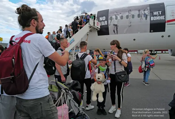  ?? ?? Ukrainian refugees in Poland. Final destinatio­n: Canada. 2022 Nick Ut © All rights reserved.