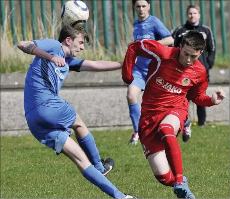  ??  ?? Gavin Sweeney, St Johns, in action with Dylan Edwards, Carbury at the weekend. Pics: Carl Brennan.