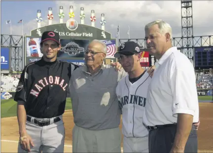  ?? MARK DUNCAN — ASSOCIATED PRESS FILE ?? In a July 15, 2003, photo, Cincinnati Reds’ Aaron Boone, left, and his brother, Bret, from the Seattle Mariners, are photograph­ed with their grandfathe­r, Ray, and father, Bob, manager of the Cincinnati Reds, right, before the 74th All-Star Game at U.S. Cellular Field in Chicago.