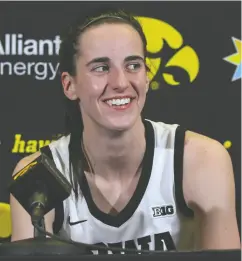  ?? MATTHEW HOLST / GETTY IMAGES ?? Guard Caitlin Clark of the Iowa Hawkeyes talks to the media after breaking the NCAA women’s all-time scoring record against the Michigan Wolverines on Thursday.