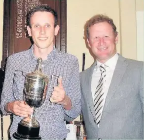  ??  ?? ●● Gareth Robinson receives the trophy The Spring Cup from sponsor Jamie Donaldson