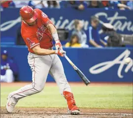  ?? Nathan Denette Associated Press ?? MIKE TROUT of the Angels leads the American League with 28 home runs, 67 runs batted in, a .453 on-base percentage and a .646 slugging percentage.