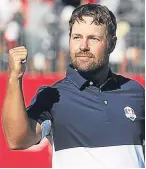  ??  ?? Ryan Moore celebrates after his last-green win over Lee Westwood confirmed the USA victory.