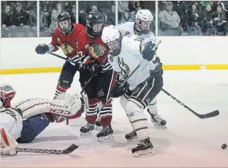  ?? CLIFFORD SKARSTEDT EXAMINER ?? Lakefield Chiefs' Ethan McDougall looks for the puck next to Stayner Siskins' goalie Marcus Semiao during Game 2 of PJHL Schmalz Cup semifinal action on Saturday at Lakefield-Smith Community Centre in Lakefield. The Chiefs lost 2-1.