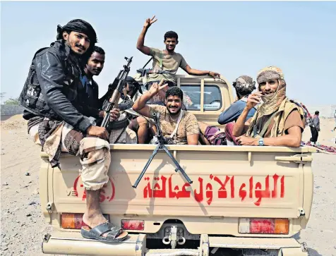  ??  ?? Yemeni progovernm­ent forces advance towards Hodeidah, as they battle with Houthi rebels for control of the city. The siege has left children like Jibril Mohammed Ali al-hakami, 2, right, severely malnourish­ed