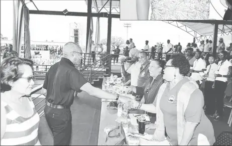  ??  ?? President David Granger and First Lady, Sandra Granger greeting the float parade judging panel at D’Urban Park (Ministry of the Presidency photo)