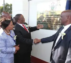  ??  ?? Acting President General Dr Constantin­o Chiwenga (Retired) is congratula­ted by Chief Justice Luke Malaba after unveiling a plaque at the official opening of Mutare High Court on Monday. Looking on is Manicaland Provincial Affairs Minister Monica...