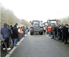  ?? /Abdul Saboor ?? Déjà vu: French farmers block the A16 highway with their tractors to protest over price pressures from the fight against inflation, taxes and green regulation grievances.