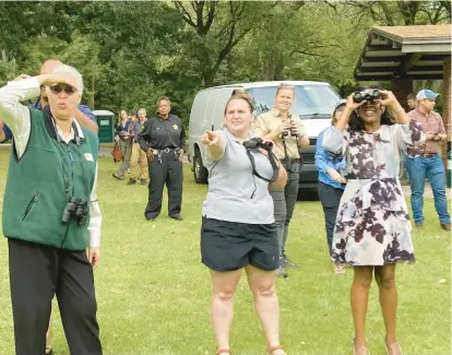  ?? TED SLOWIK/DAILY SOUTHTOWN PHOTOS ?? Cook County Board President Toni Preckwinkl­e, left, and County Board member Donna Miller, of Lynwood, right, look for birds Tuesday at Eggers Grove Forest Preserve in on Chicago’s Southeast Side.