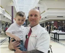 ??  ?? Jayden Percy with security guard Carl Simpson, who saved his life