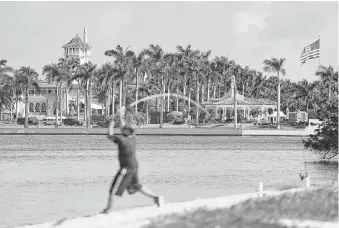  ?? Joe Raedle / Getty Images ?? A group of Florida scientists has asked to meet Donald Trump to talk about climate change, which they say could one day threaten to flood his Mar-a-Lago estate in Palm Beach.