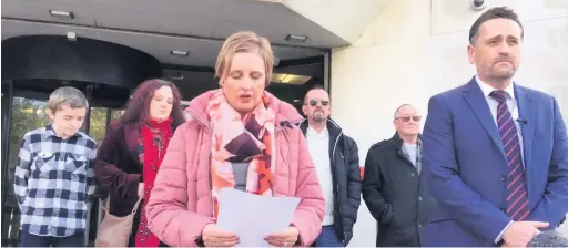  ??  ?? Family liaison officer Emma Warner-brindley and senior investigat­ing officer, Detective Chief Inspector Darren George, outside Swansea Crown Court, reading a statement from John Williams’ family, pictured behind.