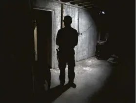  ?? Michael S. Williamson / Washington Post ?? Drew Miller stands inside a fortified bunker inWest Virginia last year. Miller is the founder of a budding network of members-only survivalis­t camps.