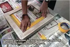  ??  ?? GUNAKAN surat khabar dan pita perekat untuk melindungi bahagian yang tidak disembur dengan cat.