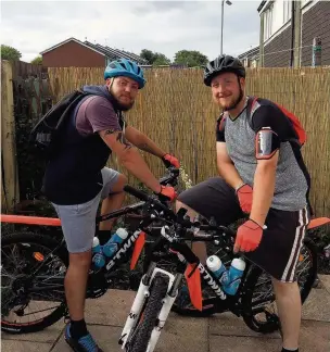  ??  ?? Darren Hastie (left) and James Prunty ahead of their bike ride