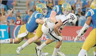  ?? Luis Sinco Los Angeles Times ?? UCLA DEFENDER Rick Wade (90) is benefiting from new approach that matches him up against guards.