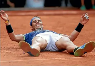  ?? BENOIT TESSIER/REUTERS ?? Rafael Nadal is the first player to win 10 championsh­ips at the same Grand Slam in the Open era.