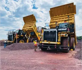  ?? ?? Mapeo-andi’s Caterpilla­r haul trucks at one of their sites. The company earned a R1.6-billion contract with Kumba Iron Ore.