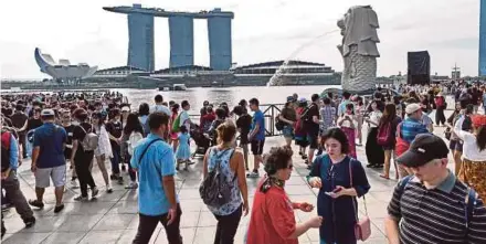  ?? AFP PIC ?? The Singapore Tourism Board has forecast visitor arrivals of 18.7 million to 19.2 million this year.