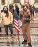  ?? GETTY IMAGES ?? Jake Angeli with supporters of President Donald Trump in the U.S. Capitol.