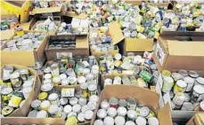  ?? FILE PHOTO ?? Thousands of cans are shown that are waiting to be packed and donated, during a food donation drive.