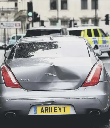  ??  ?? 0 The Prime Minister’s Jaguar as the convoy drove off from the incident; Protestor being arrested; Boris Johnson during Prime Minister’s Questions