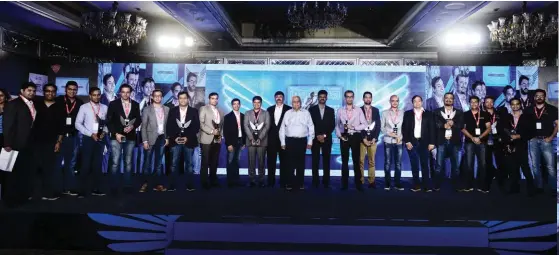  ??  ?? Winners of the ‘ Coolest Start-Ups’ with R.V. Deshpande, Minister for Large and Medium Industries and Infrastruc­ture Developmen­t, Govt of Karnataka